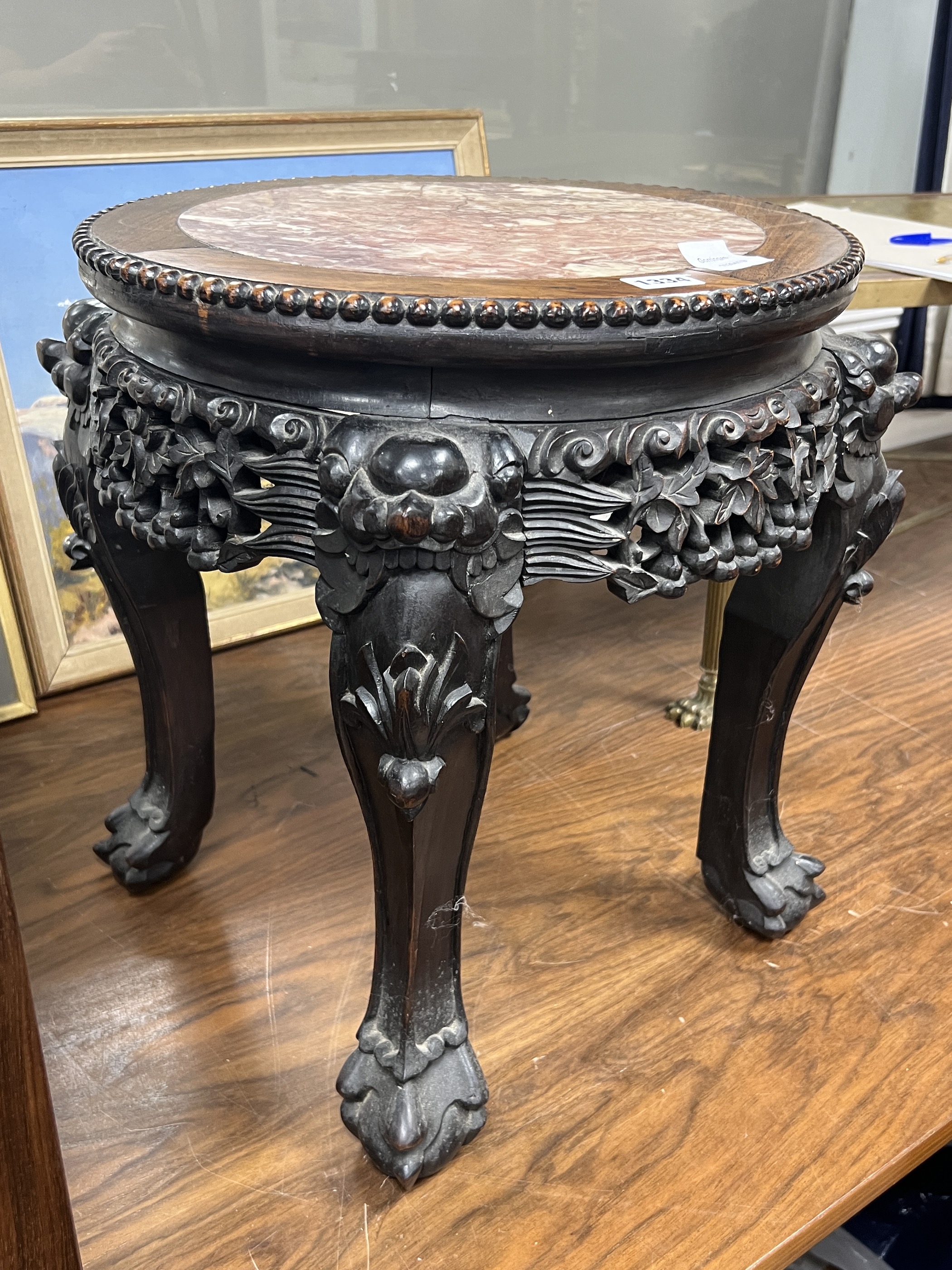 A Chinese circular hongmu and marble top vase stand, width 50cm, height 46cm